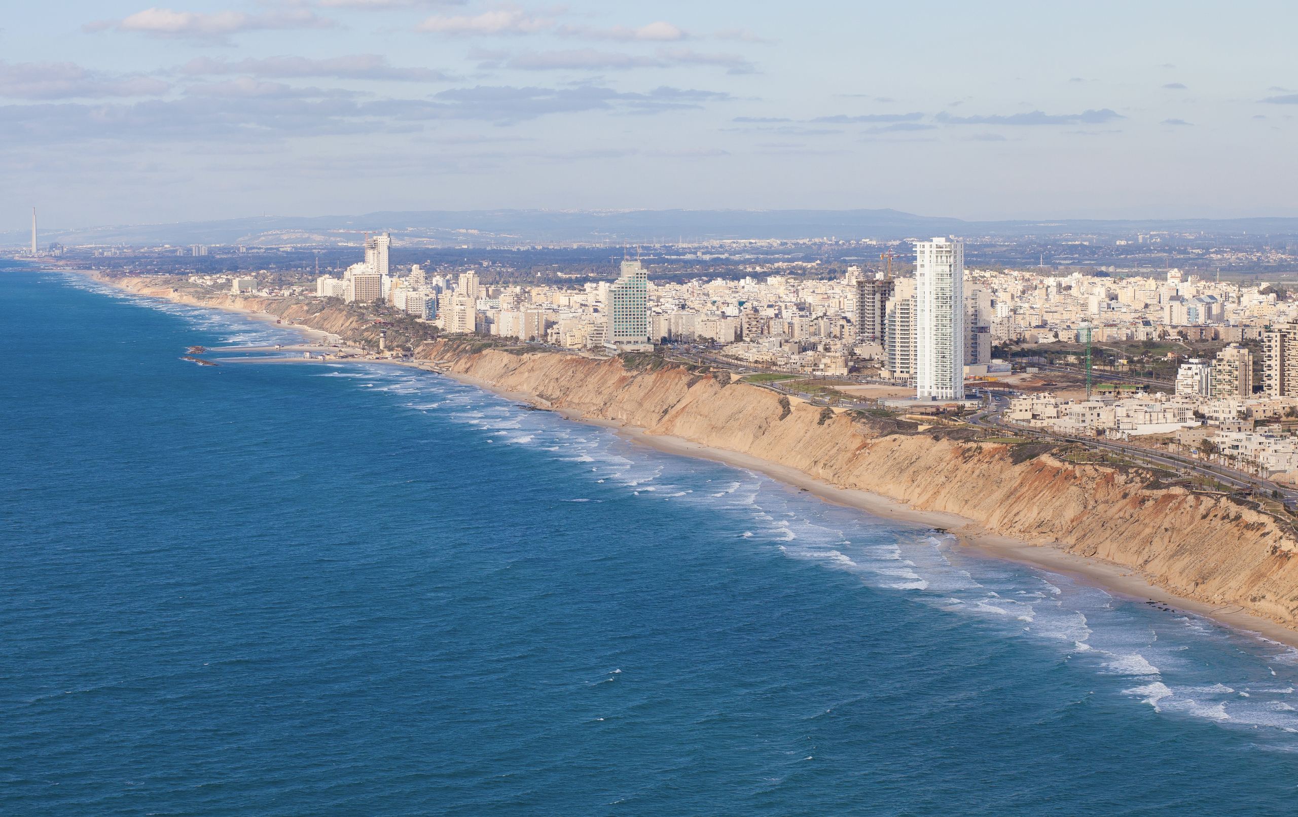 The cliff, the beach and Netanya's seafront towers