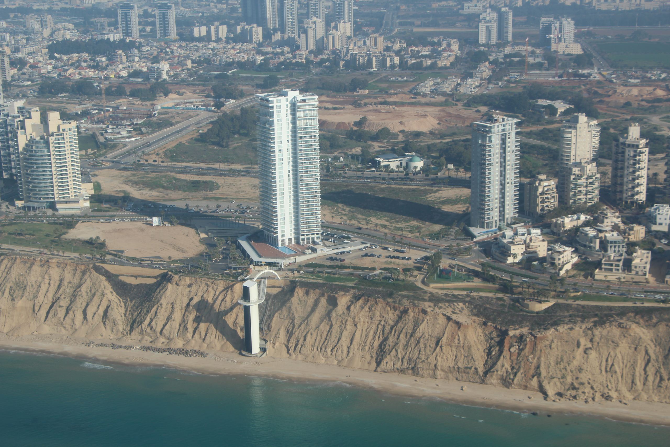Seafront towers above the cliff and the beach lift